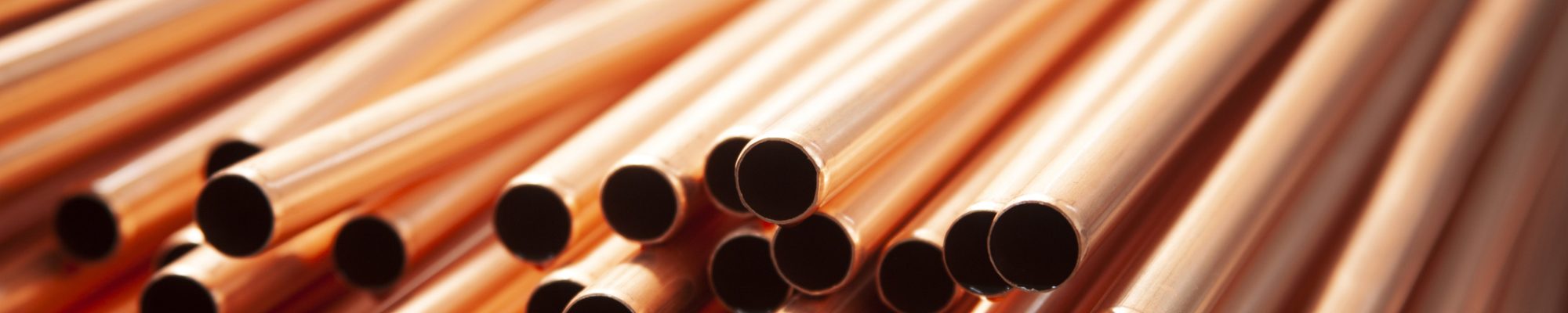 Copper pipes in factory, industrial background Copper pipes in factory, industrial background